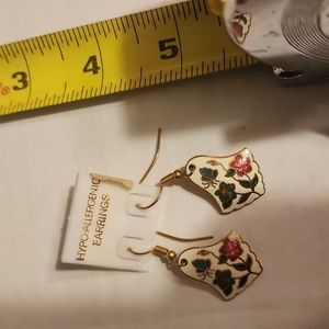 Hanging white enamel earrings with inlays